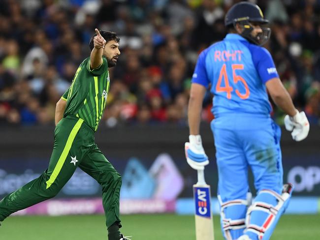 MELBOURNE, AUSTRALIA - OCTOBER 23: Haris Rauf of Pakistan celebrates getting the wicket of Rohit Sharma of India bats during the ICC Men's T20 World Cup match between India and Pakistan at Melbourne Cricket Ground on October 23, 2022 in Melbourne, Australia. (Photo by Quinn Rooney/Getty Images)