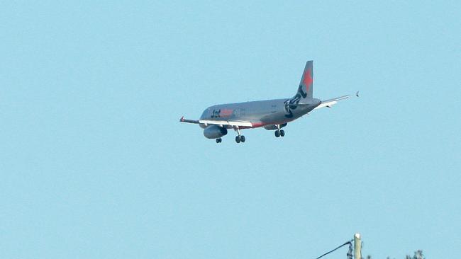 A Jetstar plane flying over Hamilton Hill heading towards Brisbane Airport. Flight path. Pic mark Cranitch.