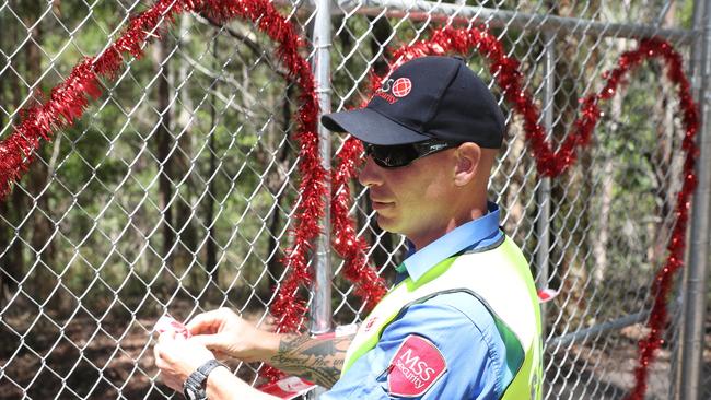 MSS Security staff Sean Degelder locks the gate to Killarney Glen. Photo: Regi Varghese