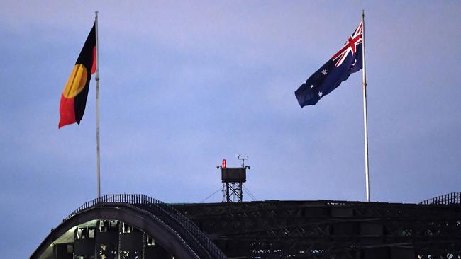 The Aboriginal flag flies beside Australia's national flag over the Harbour Bridge.