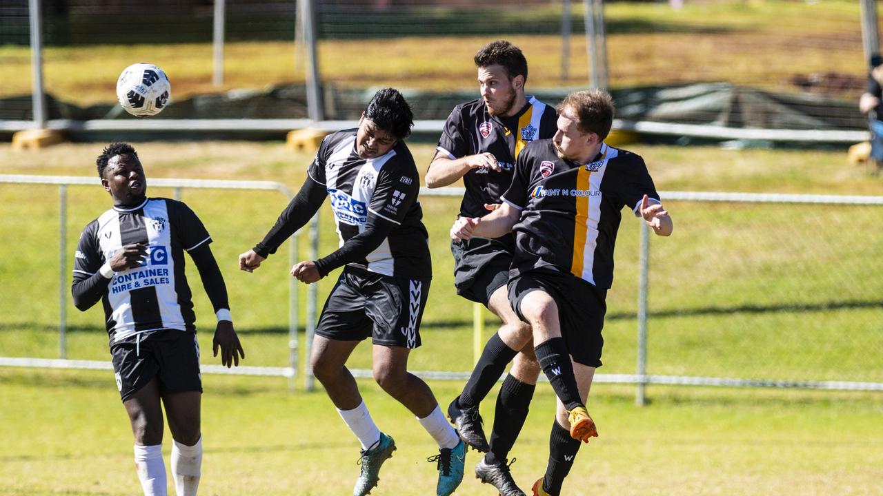 Willowburn players (from left) Peter Mayweather and Kavin Raj against Lachlan Gray and Stewart Baker of West Wanderers in U23 men FQ Darling Downs Presidents Cup football at West Wanderers, Sunday, July 24, 2022. Picture: Kevin Farmer