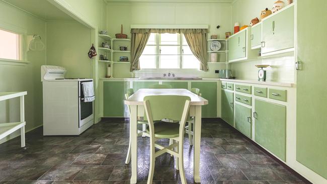 The kitchen is painted a shade of green that was popular in the 1950s. Picture: Jason McNamara