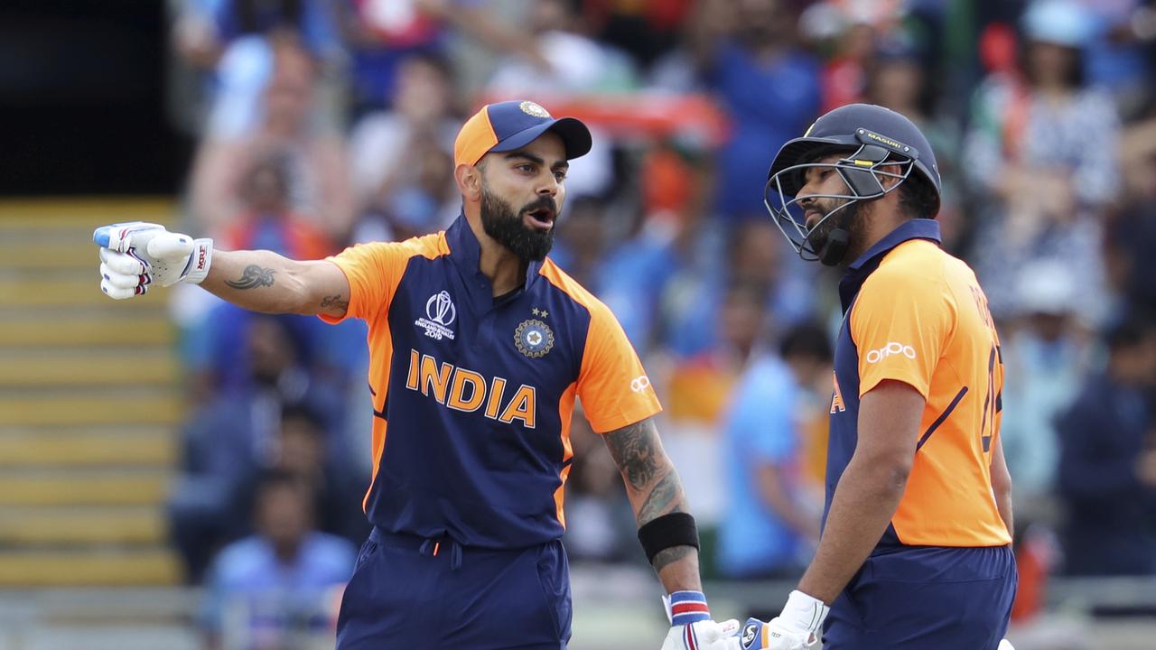 ‘Hit it to the short side’: Indian skipper Virat Kohli belting out the instructions to a teammate. (AP Photo/Rui Vieira)