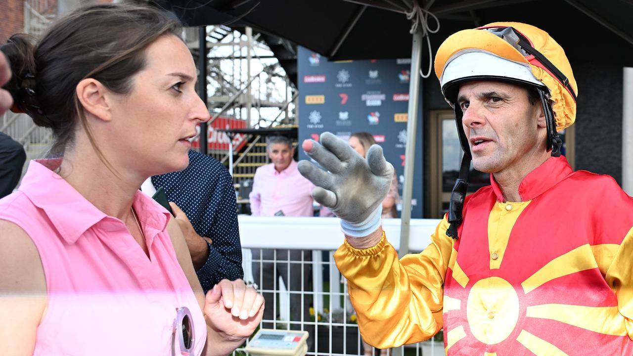 Annabel Archibald speaks with jockey Noel Callow after the race. Picture: Grant Peters/Trackside Photography