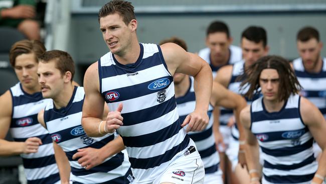 Josh Jenkins runs out for his first, and so far only, game for Geelong.