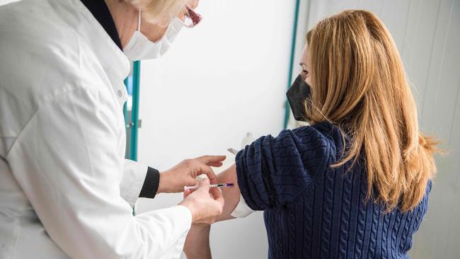 A medical worker receives a dose of the Pfizer-BioNTech vaccine in Skopje, Macedonia, following a donation of over 4,680 from Serbia. Picture: AFP