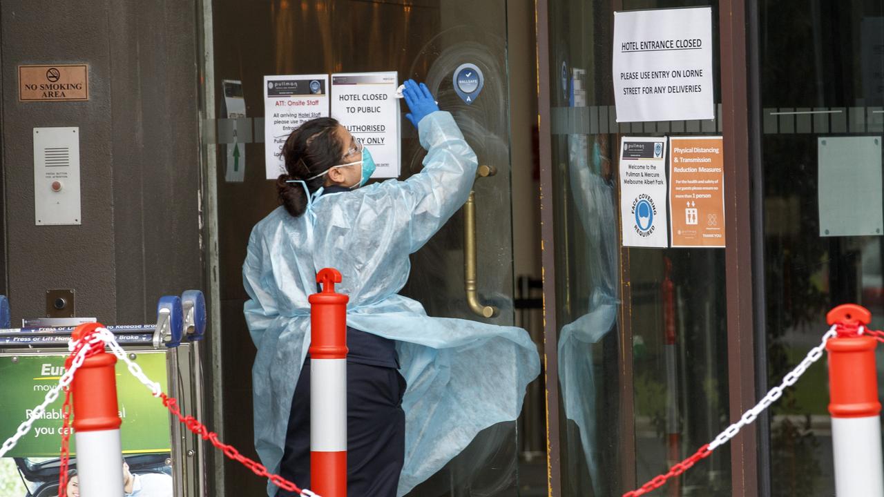 A cleaner outside the Pullman Albert Park Hotel. The Pullman is one of the hotels being used to quarantine International tennis players competing in the Australian Open.