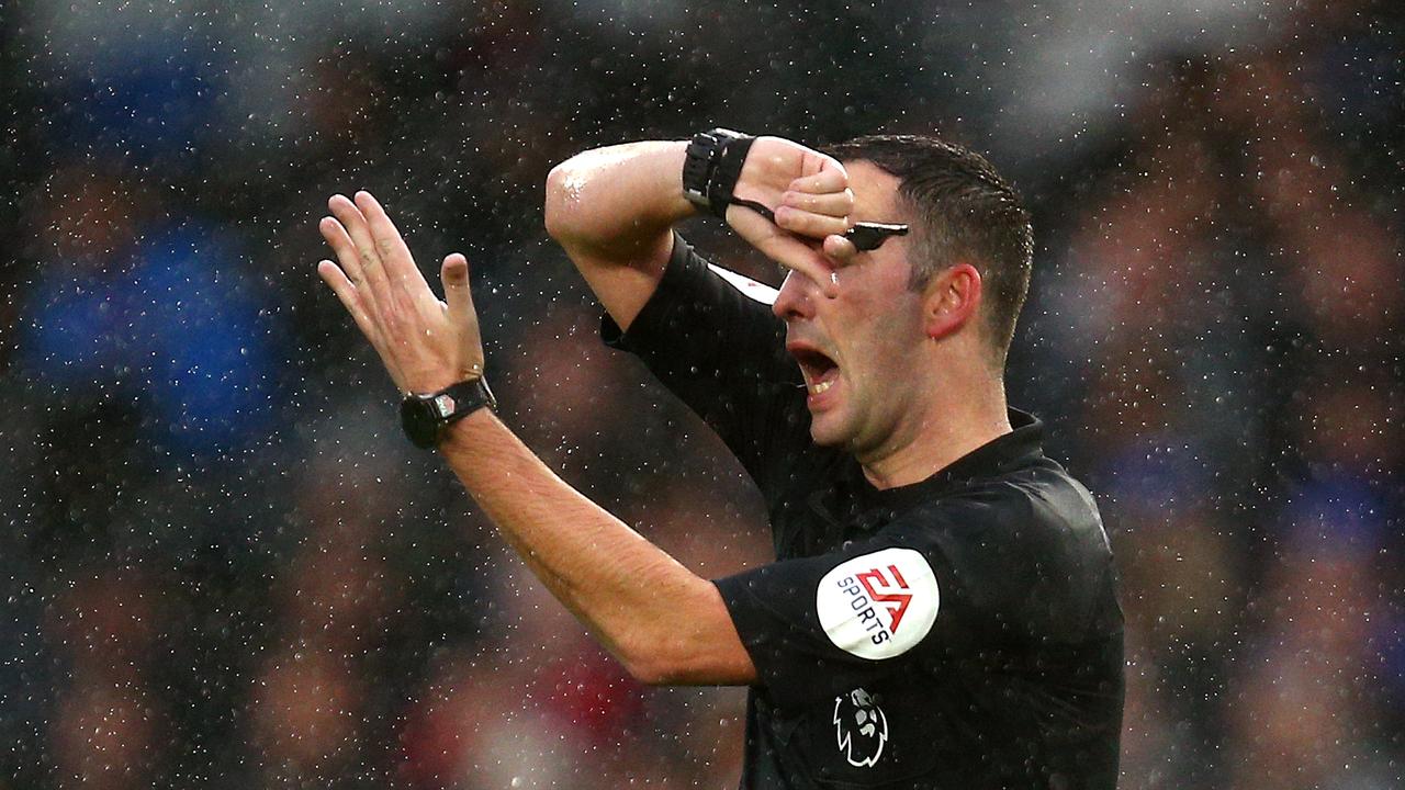 Referee Christopher Kavanagh signals a handball