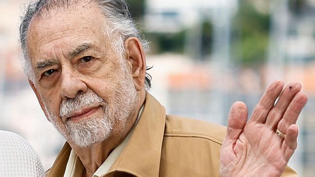 (FILES) US director Francis Ford Coppola waves during a photocall for the film "Megalopolis" at the 77th edition of the Cannes Film Festival in Cannes, southern France, on May 17, 2024. Filmmaker Francis Ford Coppola and rockers the Grateful Dead are among this year's Kennedy Center Honors inductees, along with beloved blues singer Bonnie Raitt and jazz artist Arturo Sandoval. The Apollo -- the globally celebrated Harlem music venue that launched careers and bore witness to sociocultural revolution -- will receive a special honor as an iconic US institution, organizers announced on July 18, 2024. The annual Kennedy Center Honors, among the highest American arts honors, see Washington's political elite rub shoulders with the cream of the cultural crop as entertainment A-listers descend on the US political center. (Photo by Sameer Al-Doumy / AFP)