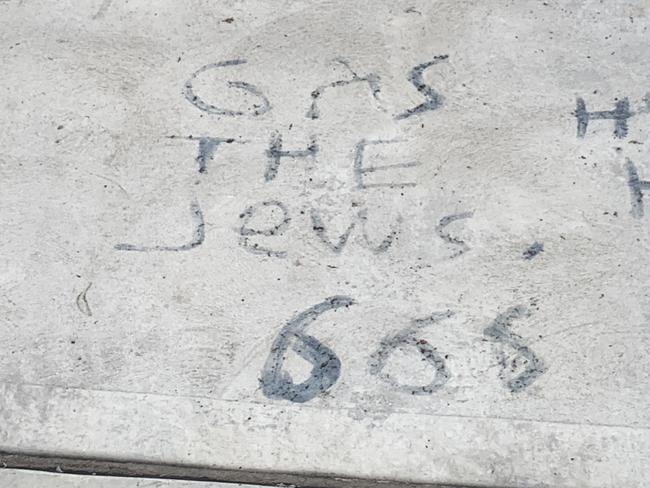 , Swastikas found etched and painted on trees and the footpath along North West Arm Rd in Gymea after a 15-year-old allegedly graffitied the area on Tuesday afternoon. Picture: Supplied,,