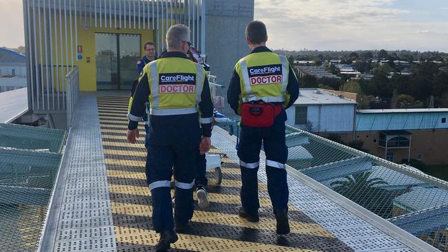 A boy, 11, from Davidson, is taken into The Children's Hospital, Westmead by doctors from the CareFlight emergency helicopter after he suffered serious head injuries while playing on a trampoline on Father's Day. Picture: CareFlight