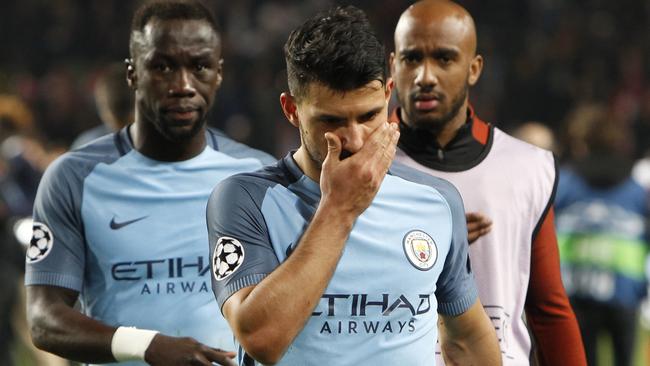 Manchester City's Sergio Aguero, center, leaves the pitch.