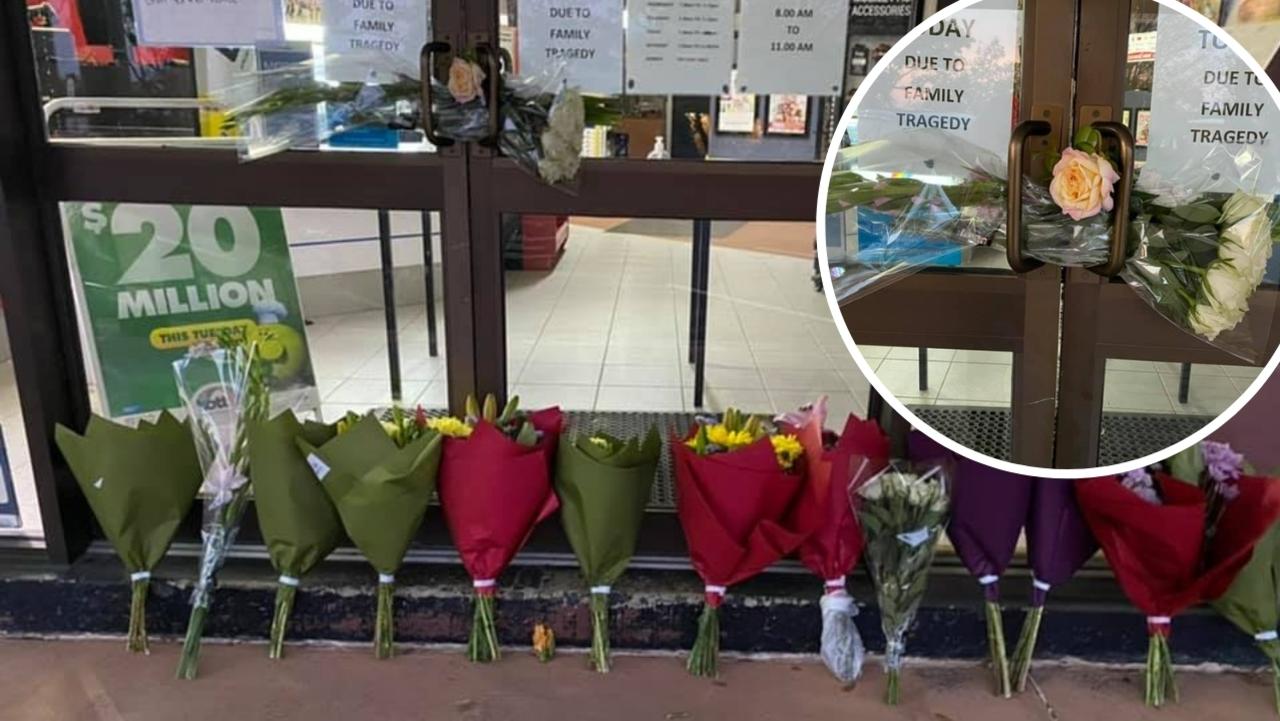 Flowers left at the Millmerran Newsagency after the tragic death of owner Ivan Oliver.