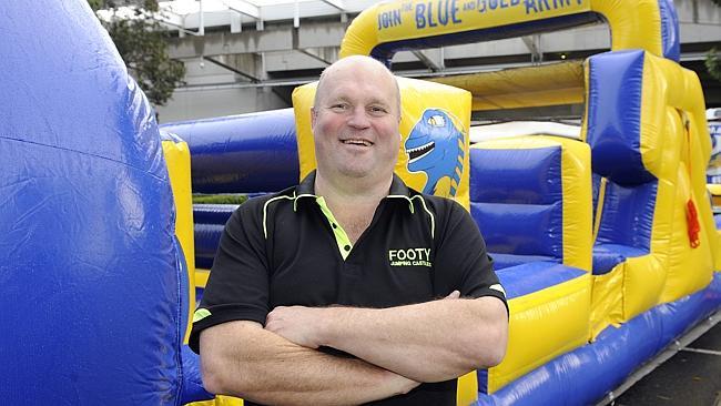  Glenn Smith has designed and created an '' Eels'' themed Jumping Castle. Glenn with the castle, outside the Parramatta stadi...