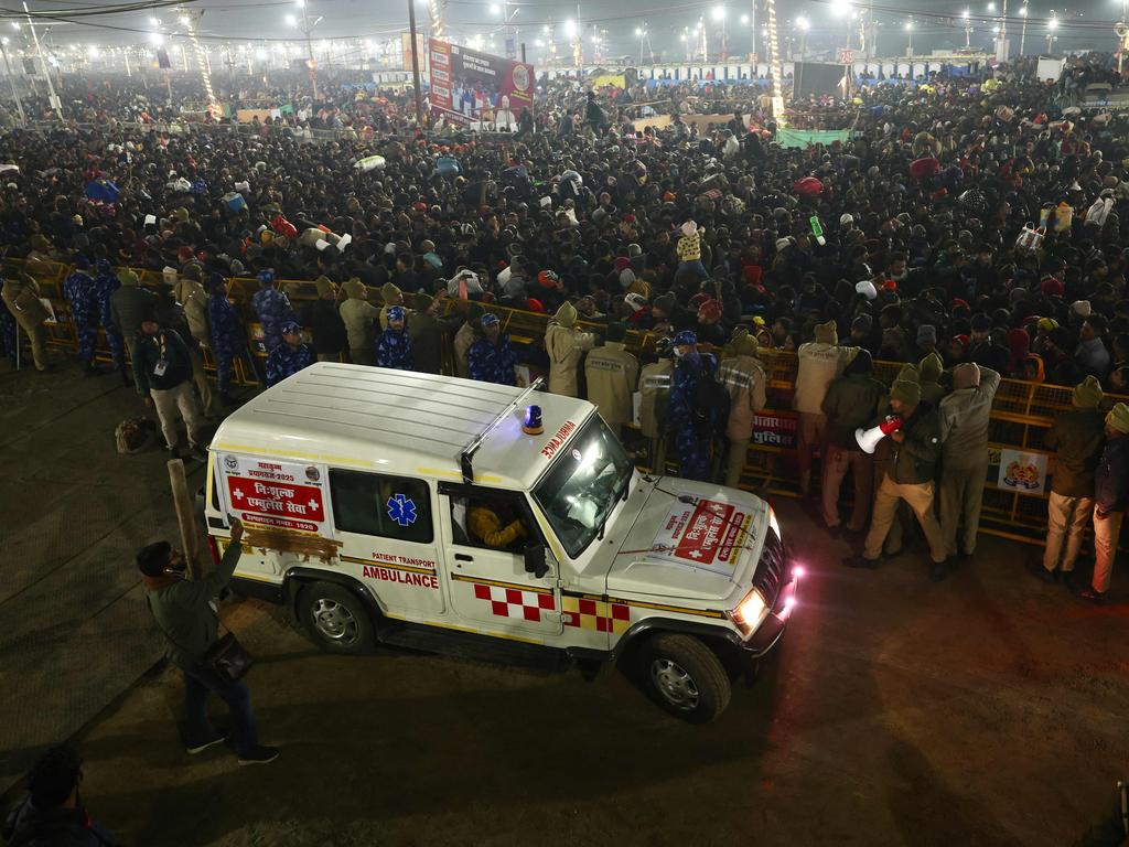 Police gather around the crowd at the site of stampede. Picture: AFP