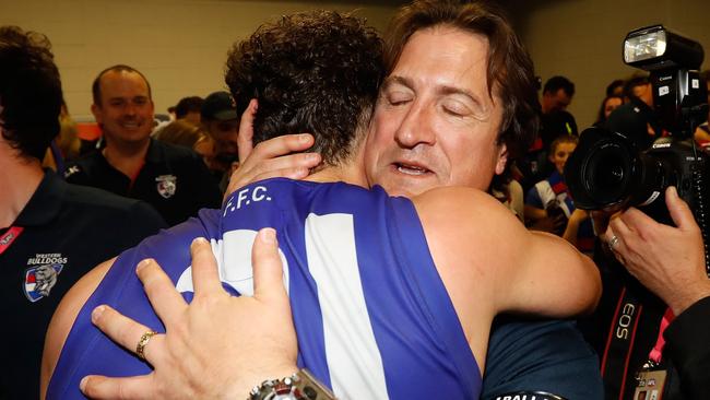 Luke Beveridge embraces Tom Liberatore after the preliminary final win.