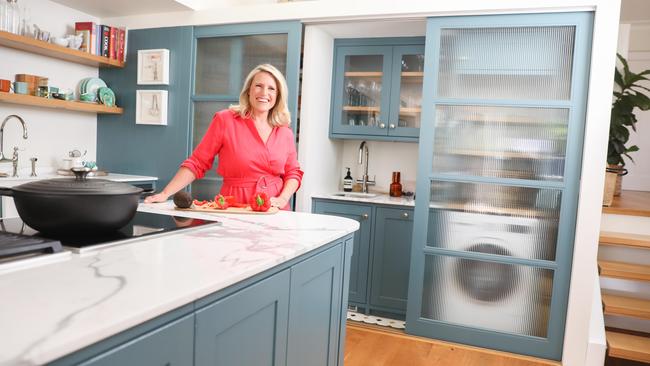 The new kitchen is part of an open plan living area leading out to the small backyard. The stairs leading to the girls’ bedroom and Moore’s master suite lead up from the kitchen. Picture: Renee Nowytarger