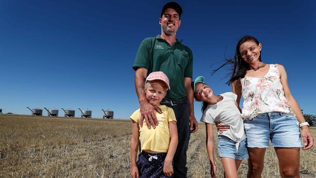 Russell Burges and Rebekah with children Rylie and Tayla on their barley farm at Meckering, 130km east of Perth. Picture: Colin Murty