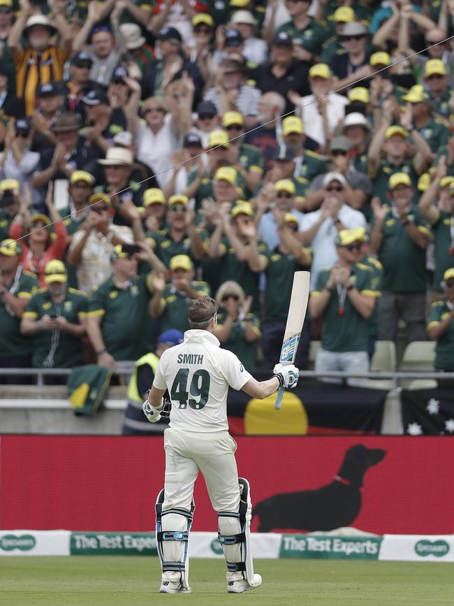 Steve Smith greets Australian fans as he leaves the field after his second century this Test.