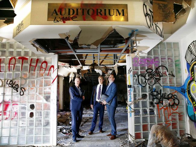 L to R: Managing Director of Heworth Development Brian Hood with Design Principal from Scott Carver, Peter St Clair and State Manager of Urban Jeff Curnow inside the Auditorium of the Balmain Leagues Club site in Rozelle, left derelict since 2009. Picture: John Appleyard