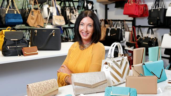 Colette Hayman pictured in 2016 with her range of designer handbags at the Colette by Colette Hayman headquarters in Brookvale. Picture: Troy Snook.