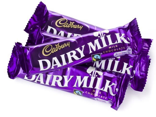 St Ives, England - August 15, 2011: Four 40g Cadbury Dairy Milk Chocolate Bars isolated on a white background.