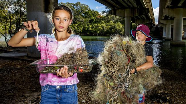 Kali and Soma have been picking up bits of abandoned fishing line and equipment up and down Tallebudgera Creek. Picture: Jerad Williams