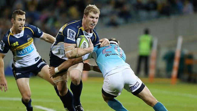 David Pocock of the Brumbies is tackled.