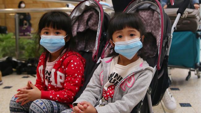 Passengers from China Eastern Flight MU749 arrive in Sydney. Picture: Getty Images