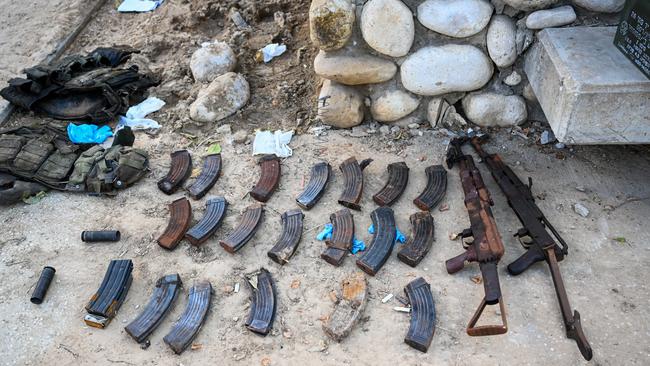 Automatic weapons, magazines, and flak jackets are displayed after Hamas militants attacked this kibbutz days earlier near the border of Gaza on October 15, 2023. Picture: Alexi J. Rosenfeld/Getty Images