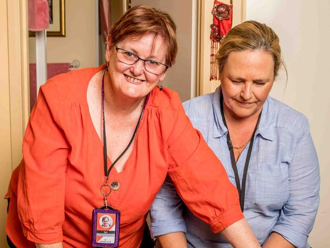 CAREERS COVER: WHERE: Berwick  WHAT: Lyn McBain (orange) has been a registered nurse for more than 50 years and is now teaching the next generation of nurses, Kerryn Gulyas, 55, passing on her knowledge. Client Rosemary MacLeod, 76. Picture: Tim Carrafa