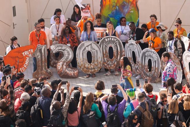 Activists protest about presence of fossil fuel lobbyists at COP28