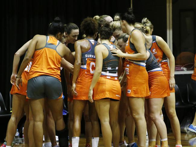 Netball friendly between the Giants (orange) and the Magpies (black) at Homebush.