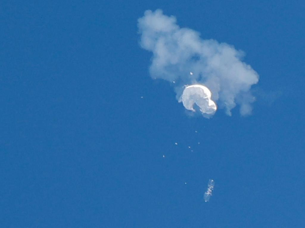 The suspected Chinese spy balloon drifts to the ocean after being shot down by an F-22 Raptor. Picture: Reuters