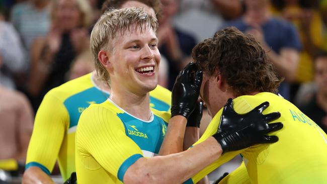 Australia's Alex Porter celebrates with teammates after his team's gold medal win and new world record in the men's 4000m team pursuit. Photo: AFP