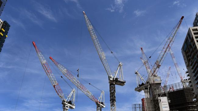 There’s plenty of cranes above the Coast these days compared to 2011 (Photo by William WEST / AFP)