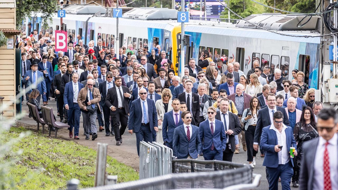 Punters arrive at Flemington station. Picture: Jake Nowakowski