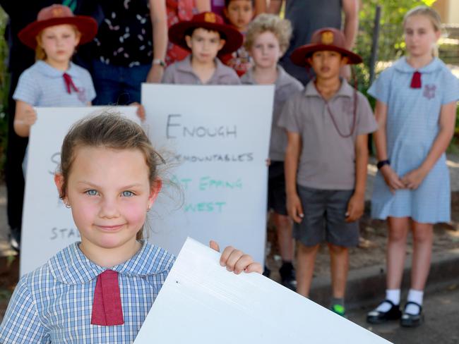 Kendall Mathews, 6, and some of her fellow Epping West Public students protest with their parents over the lack of play areas in the overcrowded school. Pictures: Angelo Velardo