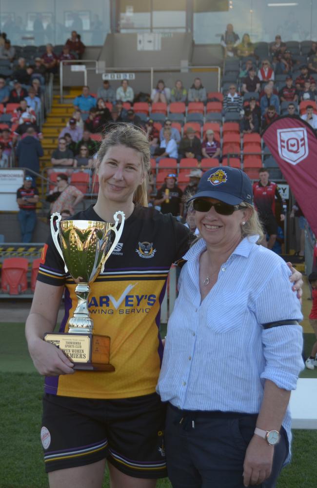 Gatton hawks women's captain Kimberley Dore receives the trophy.