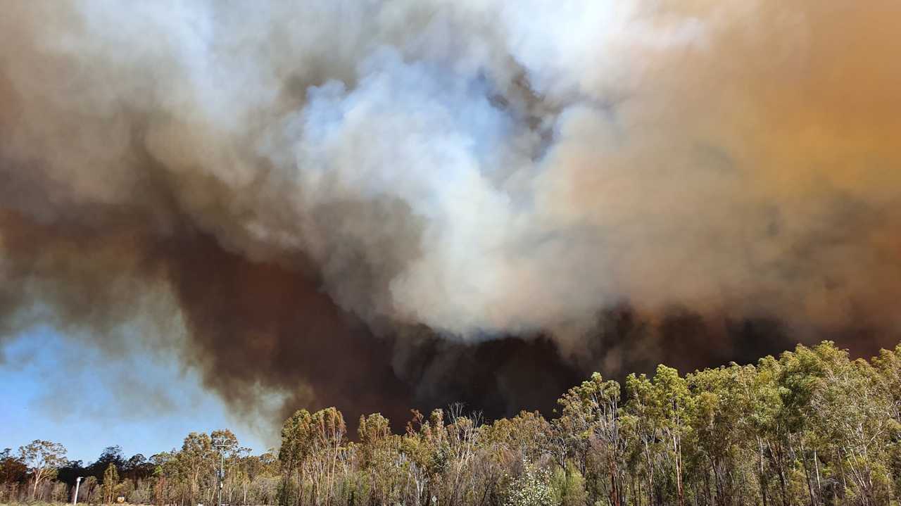 Pennie Furneaux snapped these photos of the Forest Ridge fire shortly before evacuating her home at Paddys Creek Rd, yesterday, December 4. Picture: Pennie Furneaux