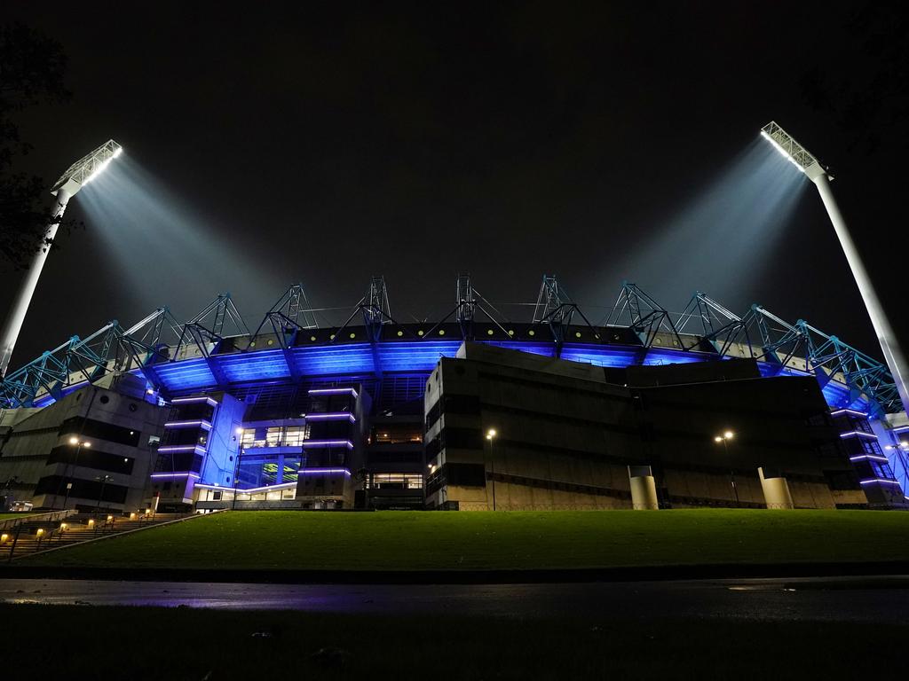 The MCG was also seen lit up in blue light. Picture: Michael Dodge/AAP