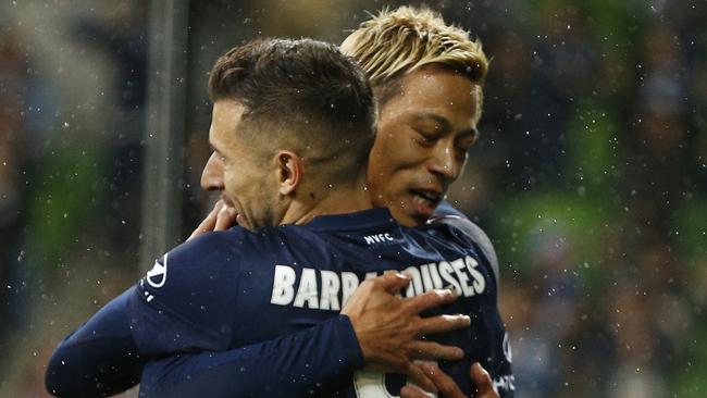 Melbourne Victory striker Kosta Barbarouses of the Victory (left) celebrates a goal with Keisuke Honda. Picture: AAP 