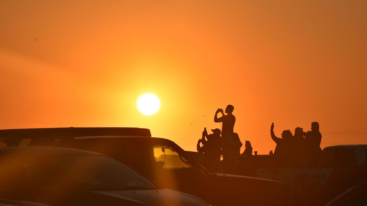 People gathered at a nearby beach in Matamoros, Mexico, to watch the launch. Picture: Diego Cruz/AFP