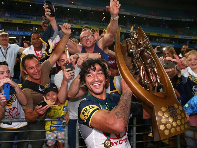 Cowboys captain Johnathan Thurston celebrates with the premiership trophy after winning the 2015 NRL grand final. Picture: getty