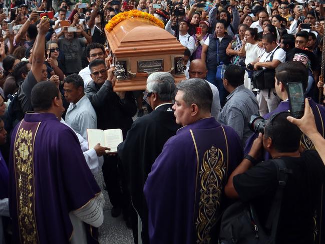 People gather to say goodbye to Chilpancingo Mayor Alejandro Arcos during his funeral cortege.