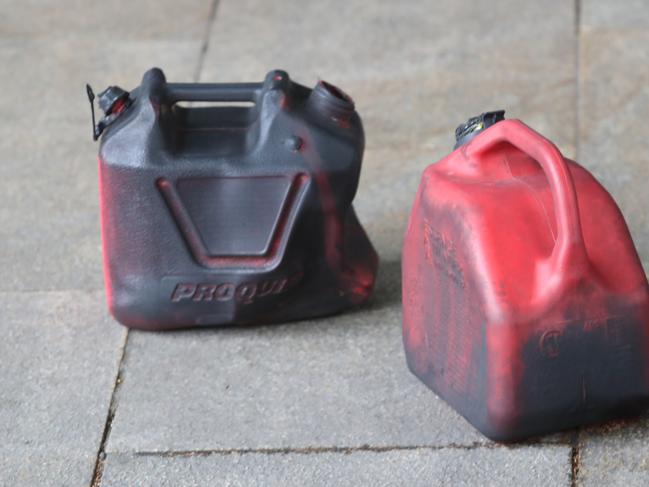 Jerry cans left outside the scene of the fire at the Freechoice tobacco store Picture: David Crosling