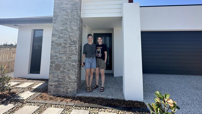 Ashlee Smallfield and her wife, Gemma, at their new home. Picture: Supplied