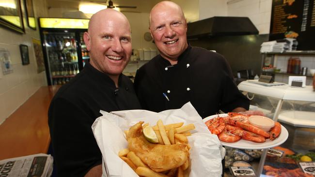 Chevron Island Seafoods wins best of the Gold Coast: fish and chips. Warren Ebbels and Frank Vayonitis with their award-winning food. Picture Glenn Hampson