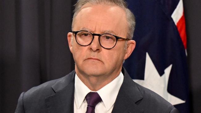 Australian Prime Minister Anthony Albanese (left) and ASIO Director-General Mike Burgess speak during a press conference at Parliament House in Canberra, Monday, August 5, 2024. (AAP Image/Lukas Coch) NO ARCHIVING