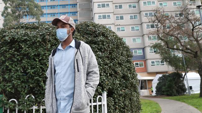 A man goes for a walk after leaving one of the towers in North Melbourne. Picture: NCA NewsWire/David Crosling